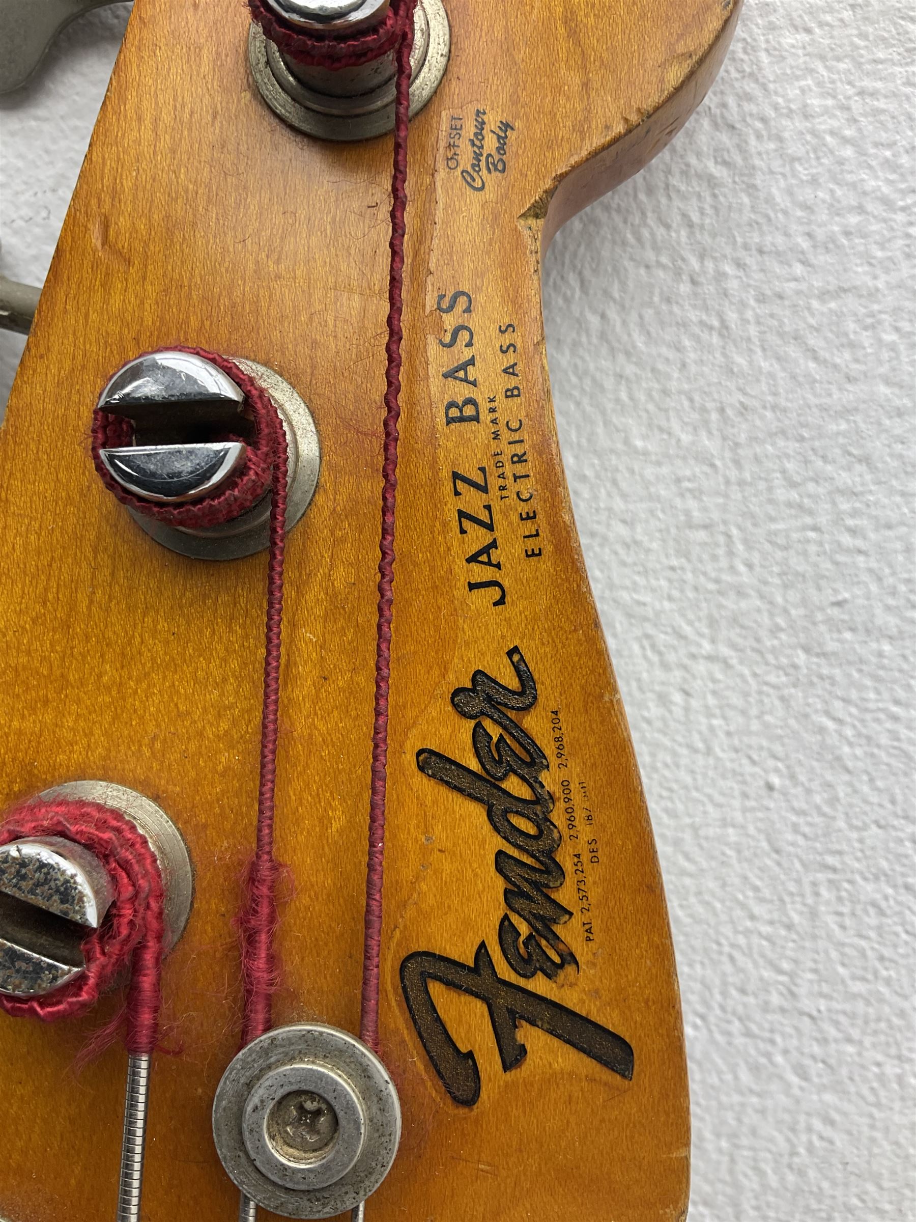 1963 Fender Jazz three-knob bass guitar; impressed with date code 7AUG63A on end of neck and serial no.L08587 on back plate; all original but re-finished in white in the 1970s; sold with photographs of the instrument in the 1960s with original finish and in the 1970s re-finished; L117.5cm; in original hard carrying case; Provenance: the professional guitar of Howard Livett from new to his death in 2005. Howard played in The Humperdincks, the backing group for Englebert Humperdinck, also played in the backing group for Max Bygraves and in the band Hedgehoppers Anonymous. The guitar is also sold with a manuscript letter of provenance from Howard's wife.