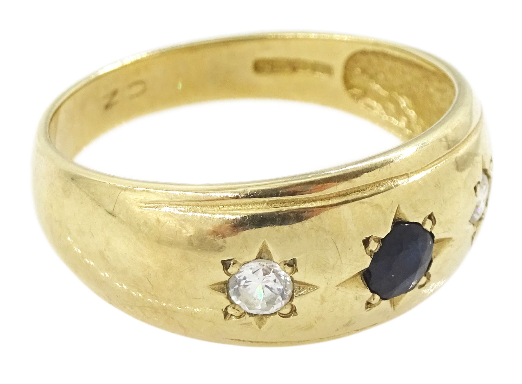 9ct gold three stone gypsy set blue and white cubic zirconia ring, hallmarked