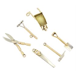 Six 9ct white and yellow gold gardening tools and other tool pendant / charms including wh...