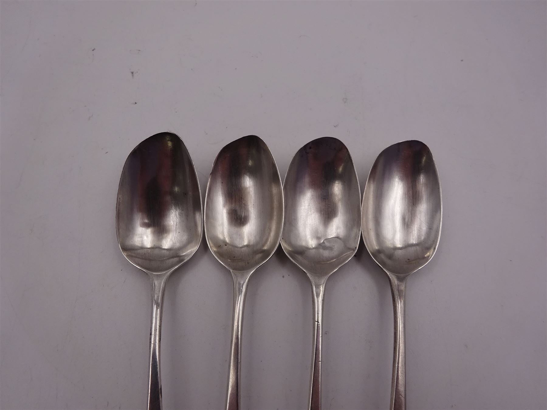 Group of silver spoons, including set of six 1930's silver coffee spoons, hallmarked W H Haseler Ltd, Birmingham 1934, contained within a fitted case, a set of four William IV Old English pattern teaspoons, no assay office mark, date letter for 1835, maker's mark worn and indistinct, a 1930's pickle fork with mother of pearl terminal, hallmarked Viner's Ltd, Sheffield 1934, and four other silver spoons, approximate total silver weight 5.39 ozt (167.5 grams)