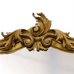 Large late 19th century Rococo revival giltwood and gesso pier mirror, the rounded rectangular frame with richly carved crest and scrolls with acanthus leaves and foliate ornamentation, above a giltwood console table with Carrara marble top and richly carved guilloche and ribbon tied laurel garland frieze, rosettes, and central scrollwork, raised upon tapered legs with beaded moulding and square block above with turned toupie style terminal  