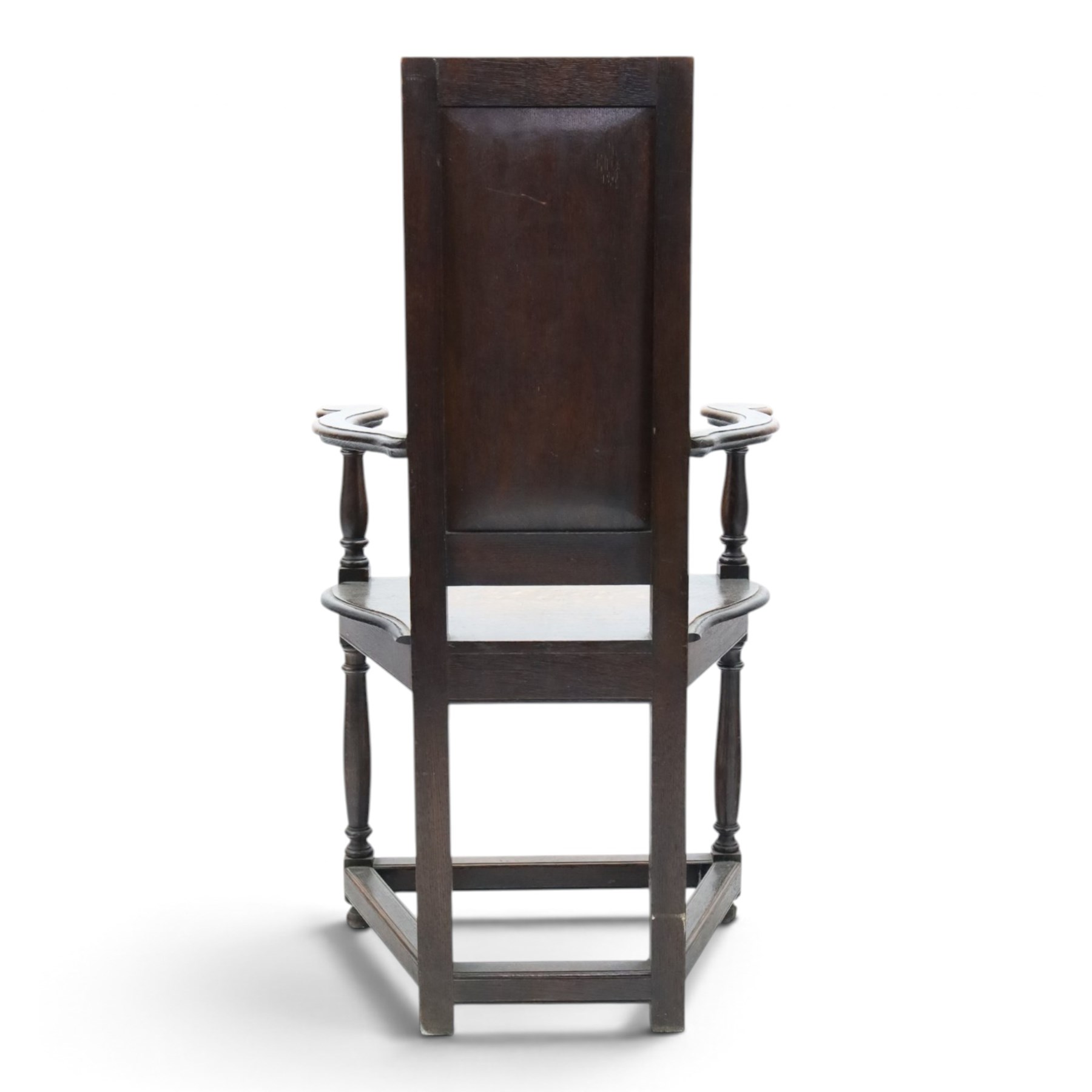 17th design century carved oak hall chair, carved back with urn and foliate details, shaped seat and arms, raised on turned supports united by stretchers