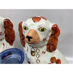 Pair of Staffordshire style dogs and a pair of Staffordshire style cats, together with a blue glass vase with painted bird, etc