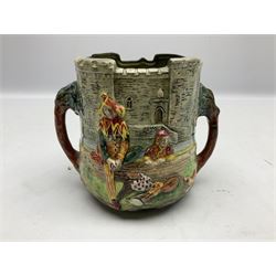 Royal Doulton Wandering Minstrel loving cup modelled by Charles Noke, decorated with figures with a castle in the background, mark to base 'A Wandering Minstrel A Merry Man Moping Mum' limited edition 7/600, H14cm