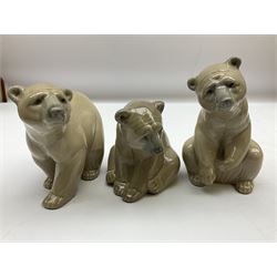 Five Lladro figures, comprising three brown bears, no 1204, no 1205 and no 1206, together with two beagles no 1070 and no 1071, largest example H10cm