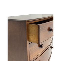 Small early 19th century figured walnut bow front chest, fitted with three graduating drawers with turned handles, with shaped apron and bracket feet