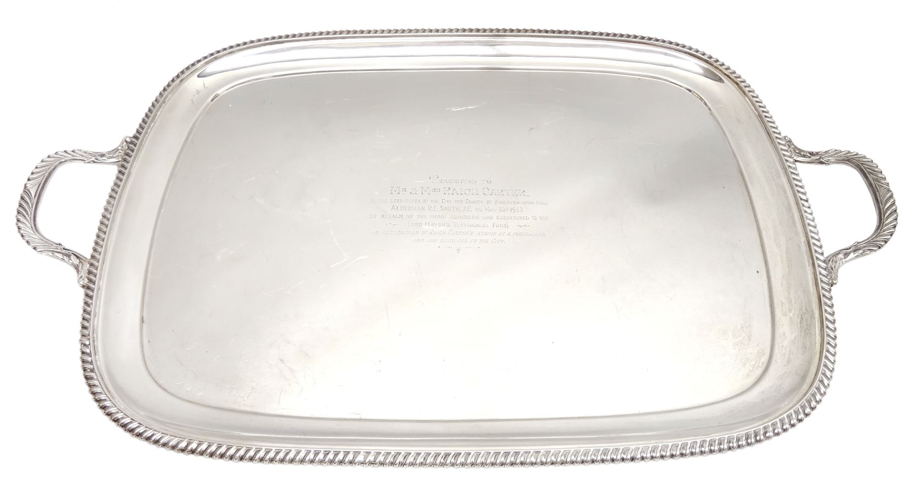 Raich Carter - presentation hallmarked silver two-handled tray of rounded oblong form with gadrooned rim by Wilson & Gill, 139 Regent Street, London, inscribed to the centre 'Presented to Mr. & Mrs. Raich Carter by the Lord Mayor of the City and County of Kingston-upon-Hull Alderman R.E. Smith J.P. on May 30th 1952on behalf of the many Admirers who subscribed to The Lord Mayor's Testimonial Fund in recognition of Raich Carter's genius as a footballer and his services to the City', London 1937 82oz L61cm; together with a hallmarked silver four-piece tea and coffee set by Cooper Bros. & Sons Ltd, the teapot of London shape with ebonised handle and knop, each piece engraved with an initial 'C', Sheffield 1920  60.5oz, teapot L29.5cm