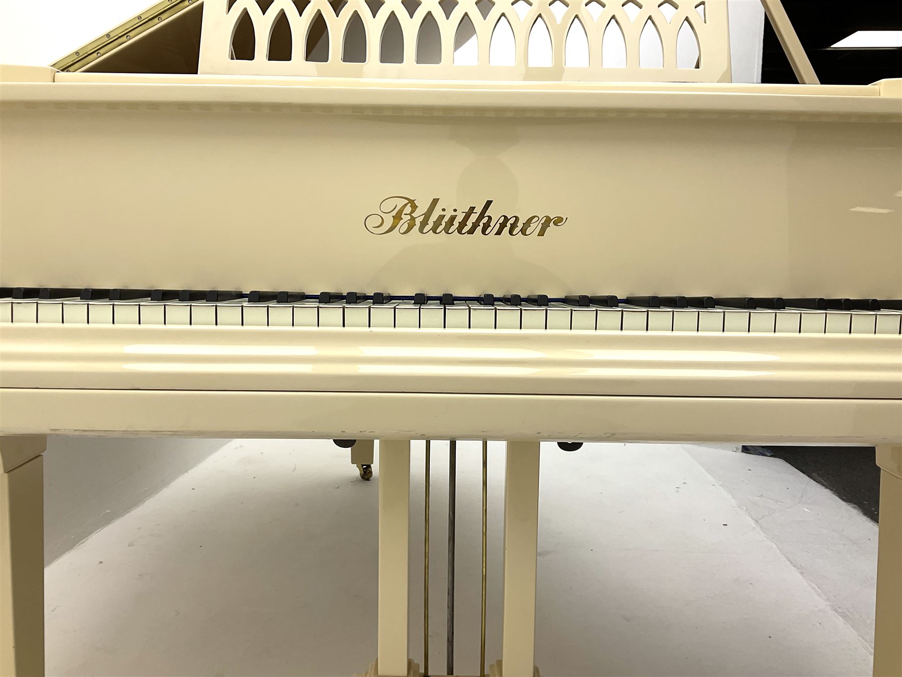 Julius Bluthner of Leipzig, Germany - Boudoir Grand Piano in cream lacquered finish with an open lattice music desk, original patent Bluthner action, recently restored and re-strung with new tuning pins, hammer heads and damper felts, re-sprayed iron frame  and re-furbished wooden soundboard with manufacturers decal and traditional 