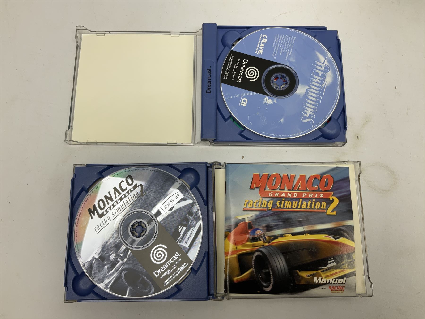 Dreamcast console, one controller, original instruction booklet with magazine and four games, ‘Aerowings’, ‘Buggy Heat’, ‘ Racing Simulation Monaco Grand Prix’ and ‘Who Wants to be a Millionaire’, all in original cases with instruction booklets 
