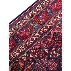 Persian Meimeh indigo ground rug, the central medallion within a field of small floral lozenge motifs, the guarded border with repeating pattern