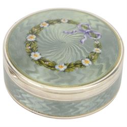 Early 20th century silver and guilloche enamel trinket box, of circular form, decorated throughout with pale green guilloche enamel and a floral wreath to the hinged cover, opening to reveal a gilt interior with personal engraving, import marks for Erich Kellerman, London 1909, D6cm