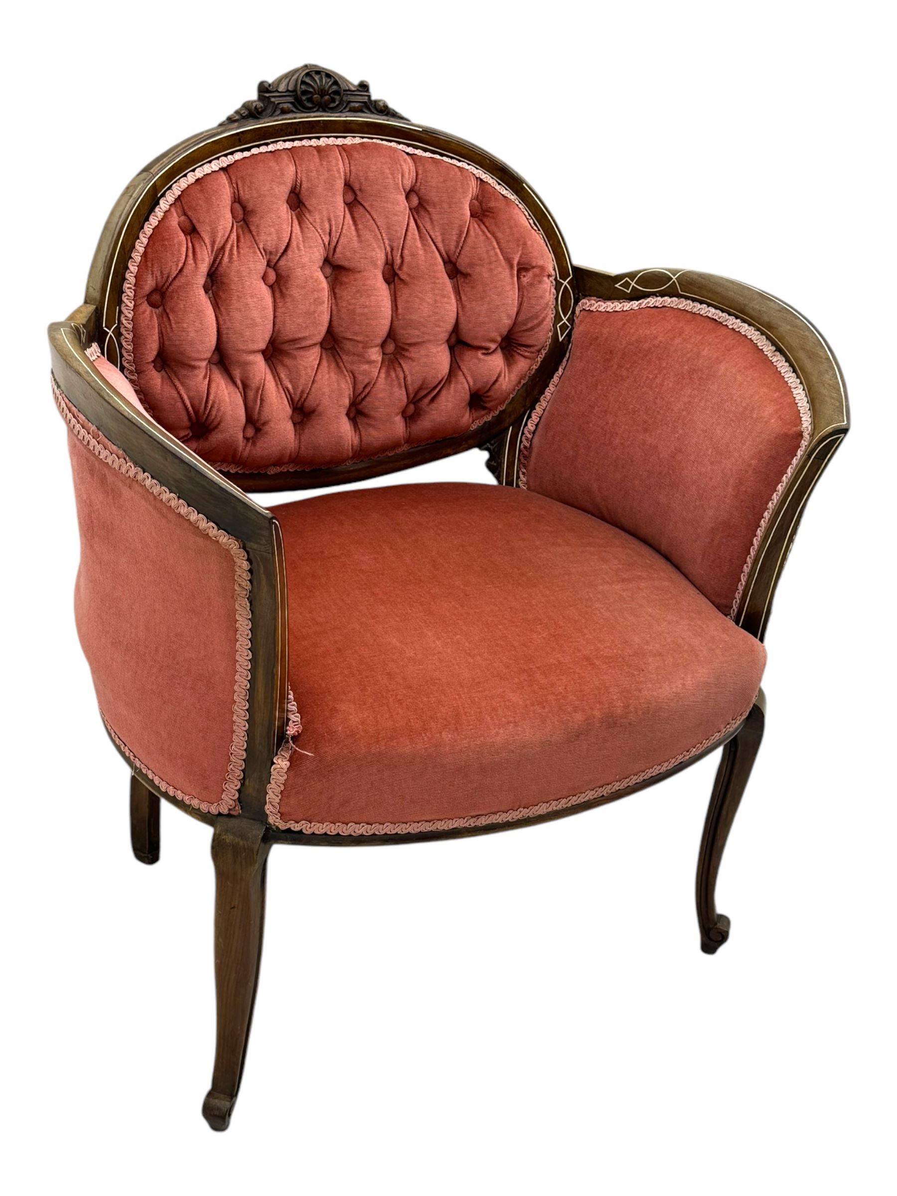 Edwardian inlaid rosewood parlour suite, comprising pair of tub shaped armchairs (W77cm, D69cm, H88cm); and matching two-seat sofa (W112cm, D69cm, H88cm), each with carved crest rails with shell motifs, deep button-tufted oval backs upholstered in pink fabric with braid trim, on cabriole supports