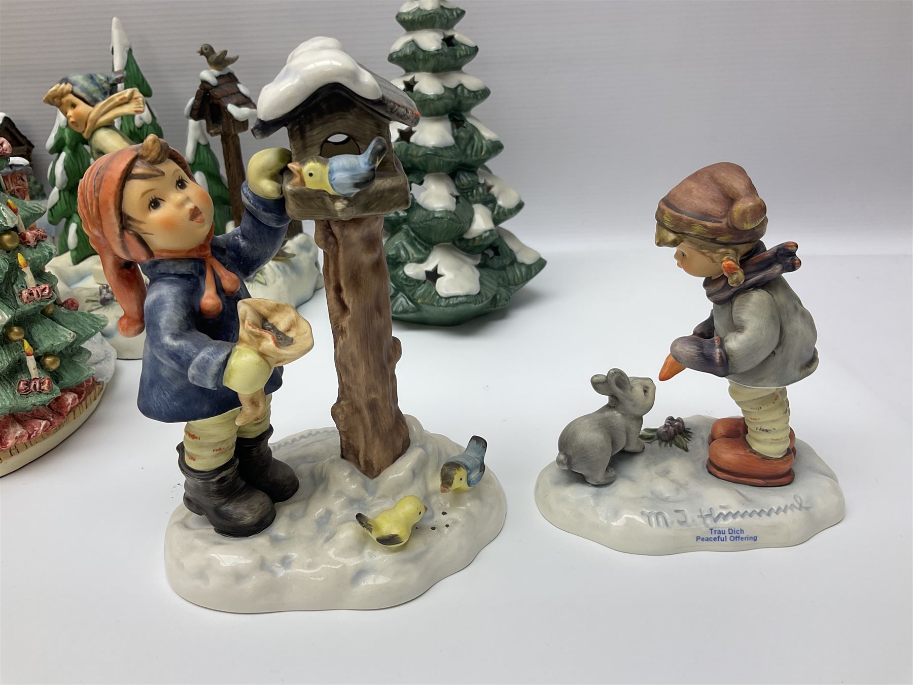Large collection of Christmas themed Hummel figures and Hummel scapes by Goebel, to include Winter Friend, Making New Friends, Tree Trimming Time, Winter Adventure etc