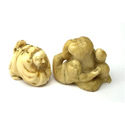 An early 20th century Japanese netsuke, modelled as a crouching figure with toad upon back, H3cm, together with a small early 20th century carved figure modelled as an orangutan with young, H4cm. 