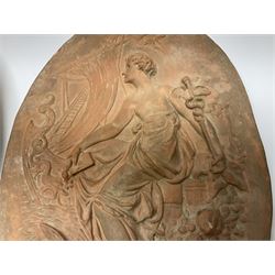 Pair of 19th century classical terracotta relief wall plaques depicting the goddess Hygeia and another goddess, seated holding an ewer, each of oval form, indistinctly signed, each stamped Ferreira verso, H42cm, W30cm