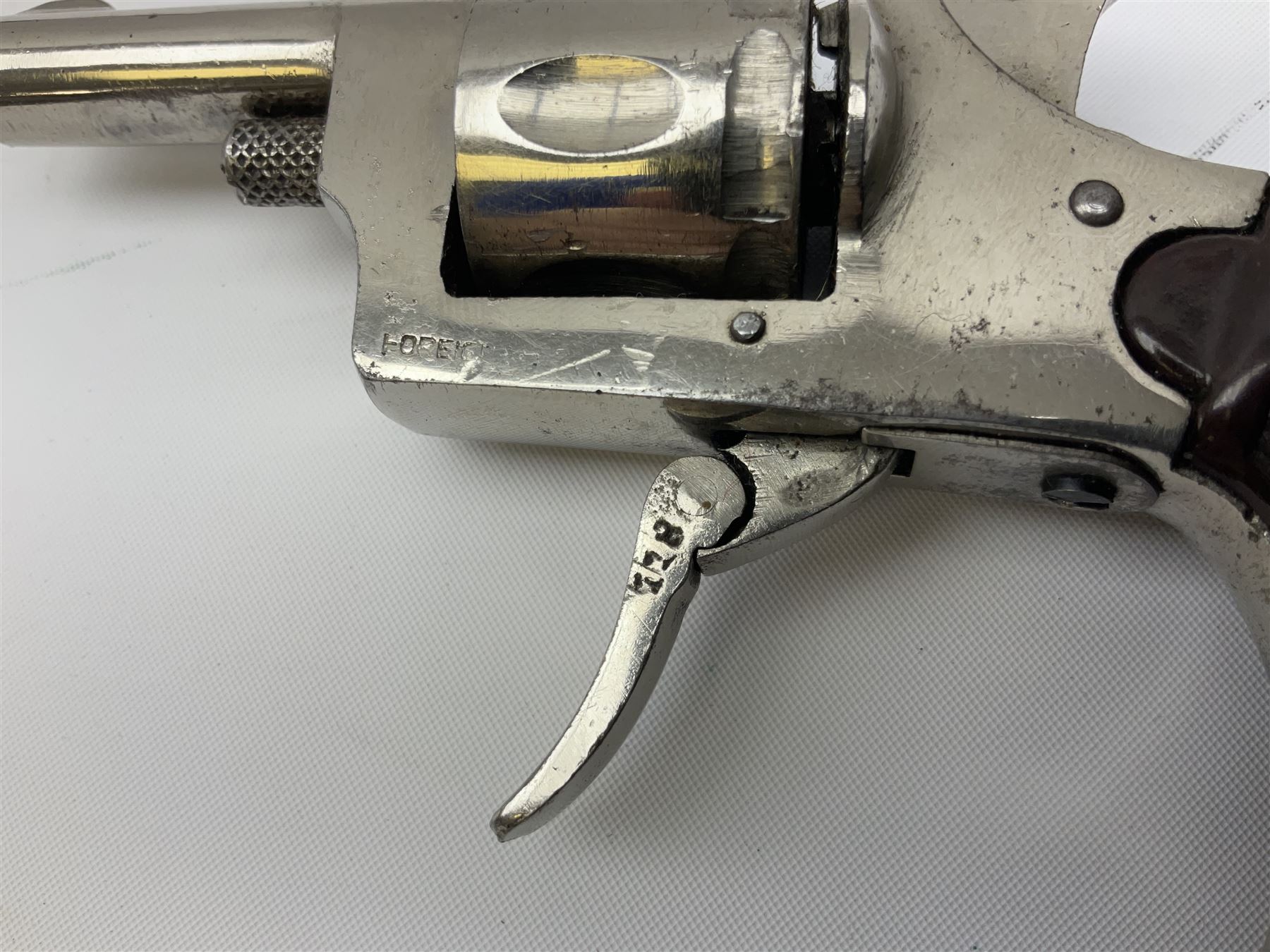 Early 20th century Flobert 5mm blank firing revolver with six-shot chamber, top venting, nickel plated with folding trigger No.118 L12.5cm overall; replica non-firing 'British Bulldog' revolver; and Windproof gas lighter inscribed 'Revolver-99 Spring and Autumn' in holster marked 'Star-Line'