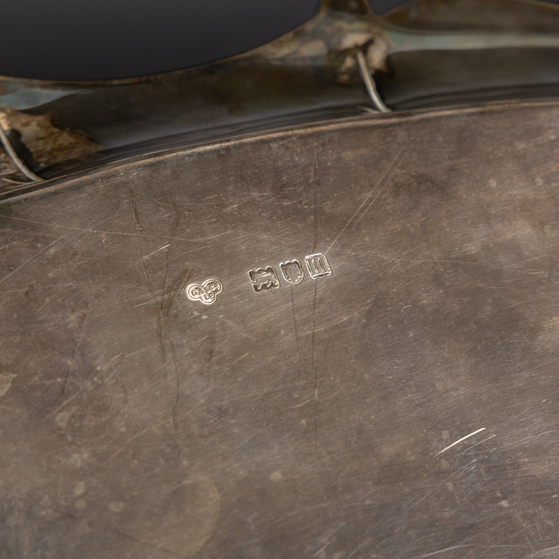 Edwardian silver twin handled tray, of navette form with C scroll decoration to the outer rim, hallmarked Goldsmiths & Silversmiths Ltd, London 1907, handle W61cm