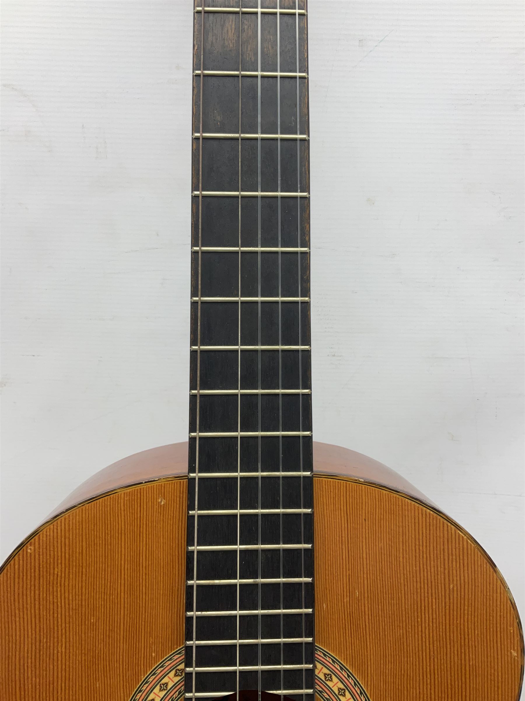 Spanish BM acoustic guitar with mahogany back and sides and spruce top L101cm; in cello carrying case; Roland foot pedal and two Yamaha foot pedals; tin D# organ pipe; folding music stand etc