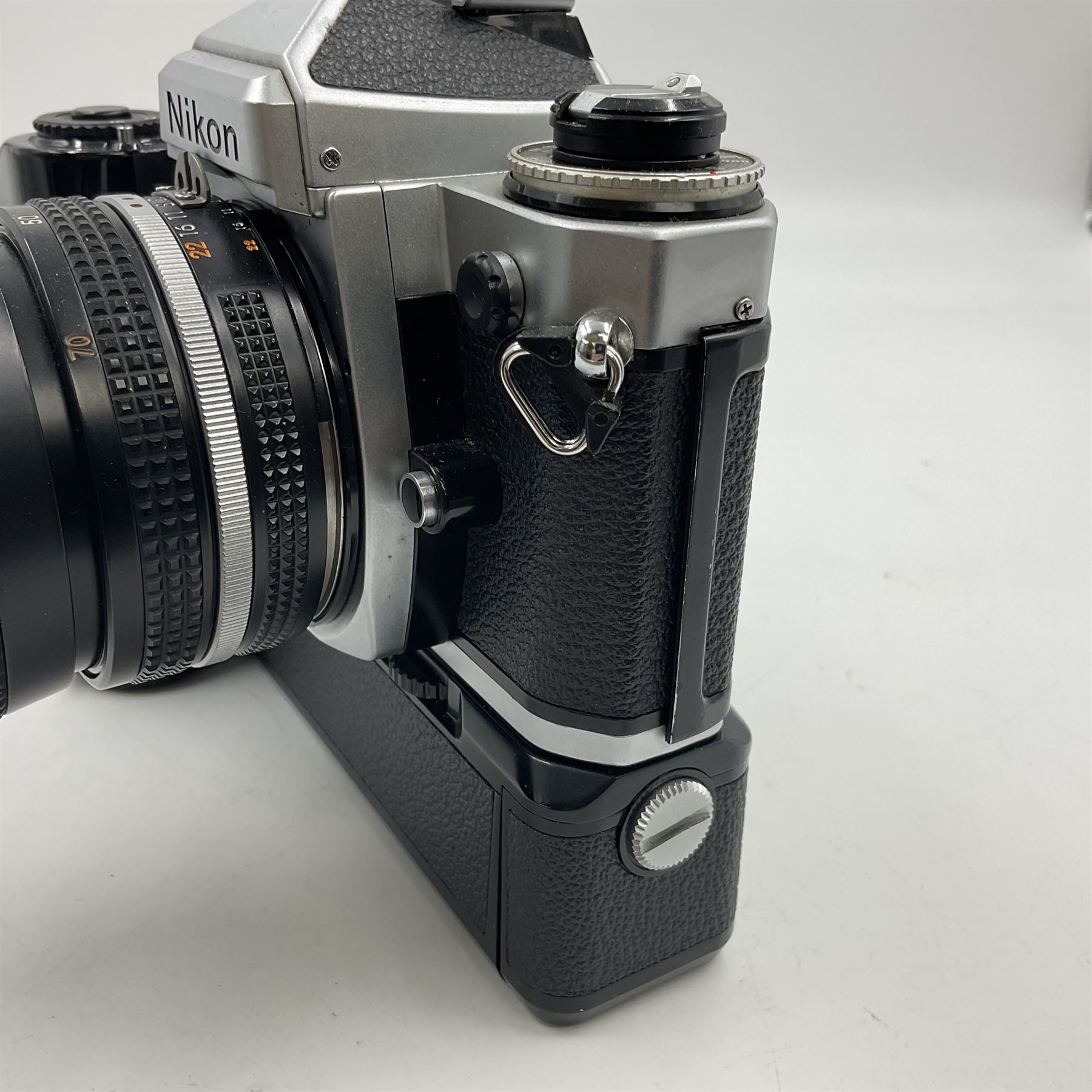 Nikon FE2 camera body, serial no. 2043167, with 'Nikon Zoom-NIKKOR 35-70mm 1:3.3-4.5' lens, serial no 3006624 and Nikon MD-12 Motor Drive, serial no. 1679037