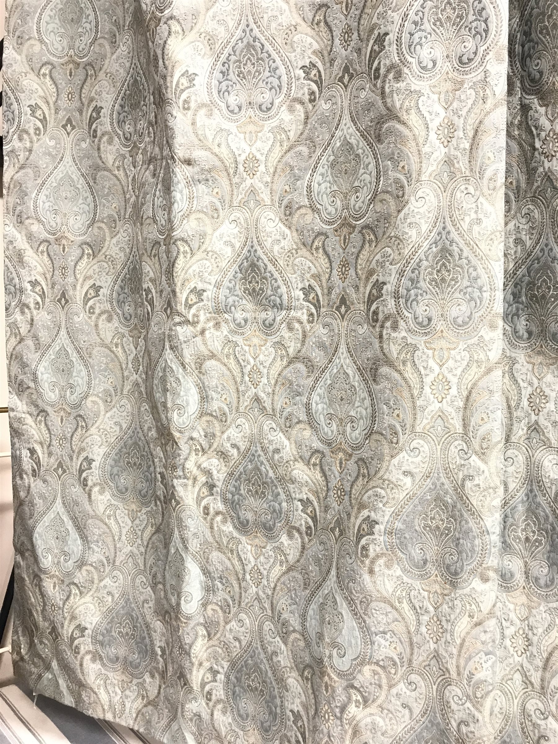 *Pair lined curtains in light blue paisley patterned fabric, W220cm