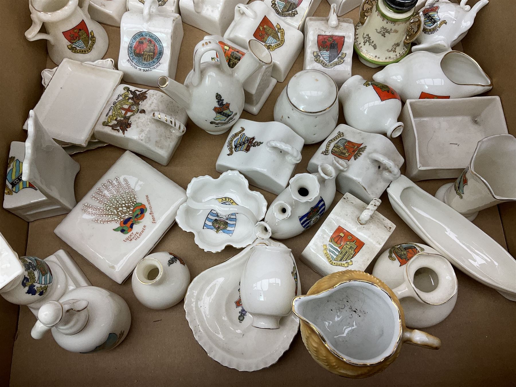 Collection of crested ware, to include Scarborough Willow Art coal truck, Whitby Willow Art Burns and Highland Mary figure group, Carlton China beer drinker 'Tak Hod an Sup Lad', and 'Here's ta me an'ma wife's usban', lighthouse, boat, Kingsway Art China Sir Walter Scott's Chair, butter dishes, candlestick, pianos etc