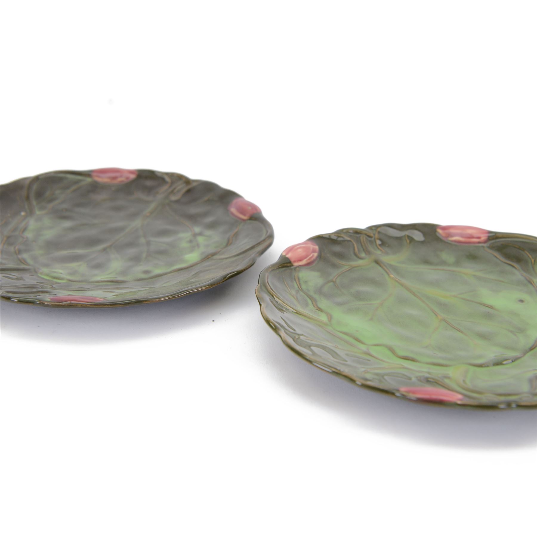 Two Zsolnay Pecs lotus moulded teacups and saucers, with impressed mark beneath