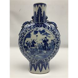 19th century Chinese blue and white moon flask vase, the central panel depicting musicians, bordered by floral, foliate and scroll decoration, with lizard handles to each shoulder, upon an oval foot, H31cm 