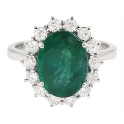 18ct white gold oval emerald and diamond cluster ring, hallmarked, emerald approx 3.20 carat, total diamond weight approx 0.60 carat