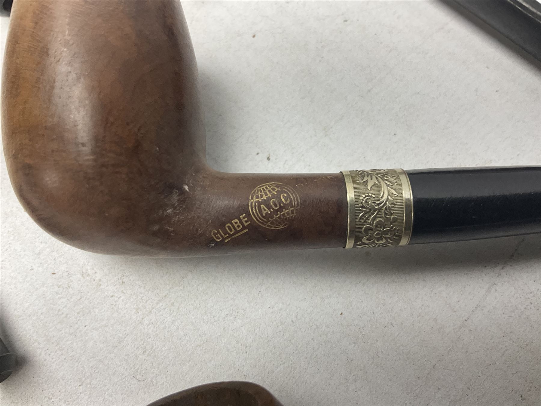 Collection of eight silver mounted pipes, comprising a briar wood Imperial ITC example with silver collar hallmarked A.W Birmingham 1903, horn handled example with silver collar hallmarked LB, probably Louis Blumfeld, Birmingham 1900, three examples marked B.W, one marked Globe A.O.C, Blumfeld's Best Briar pipe marked BBB and Riseagle example, together with two further pipes (10)