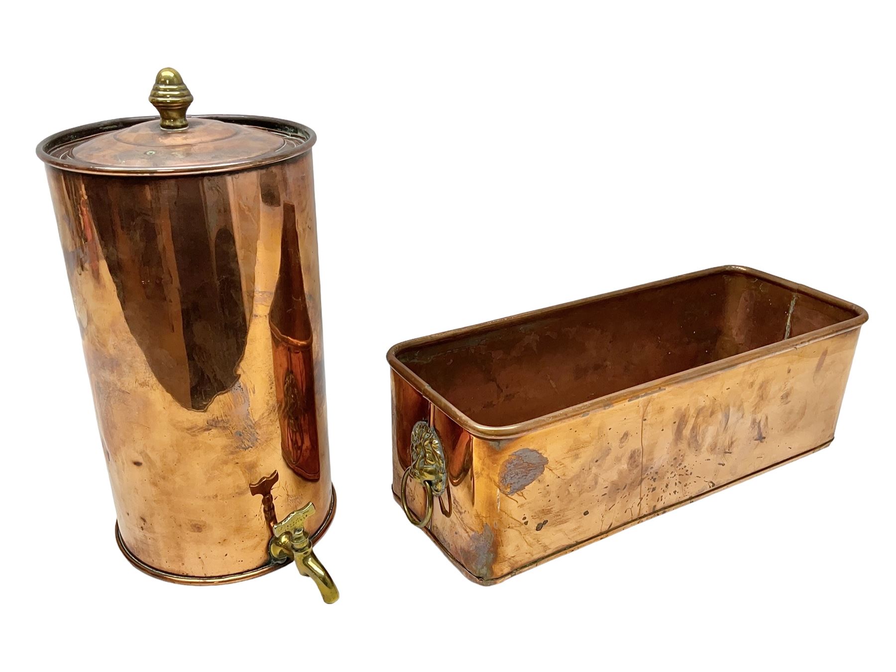 Victorian copper hot water urn, the body of plain cylindrical form with brass tap, the slightly domed lid with brass finial, together with a rectangular copper planter, with twin brass lion mask handles, urn H35cm