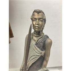 Spanish carved figure of Don Quixote, holding a book, base stamped 'Ouro, together with two spelter figures and one other