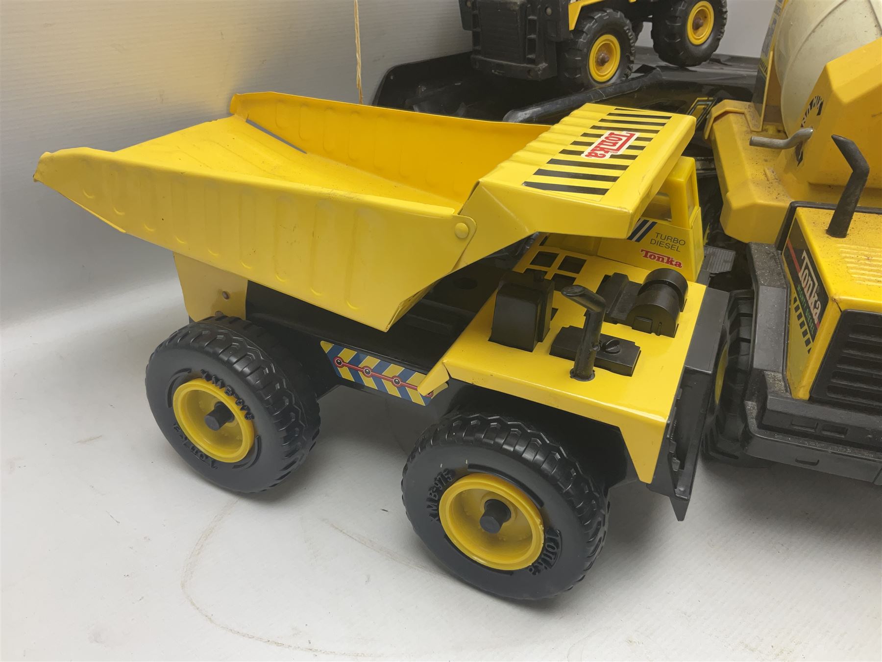 Tonka - five large scale steel pressed vehicles comprising Cement Mixer, Car Transporter, Mobile Crane and two Dumper Trucks (5)