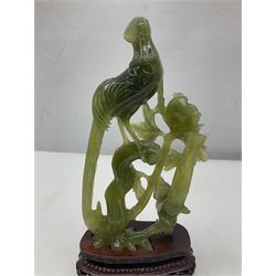 Carved jade figure of a phoenix perched on a flowering branch, upon a wooden stand, with original box, H27cm