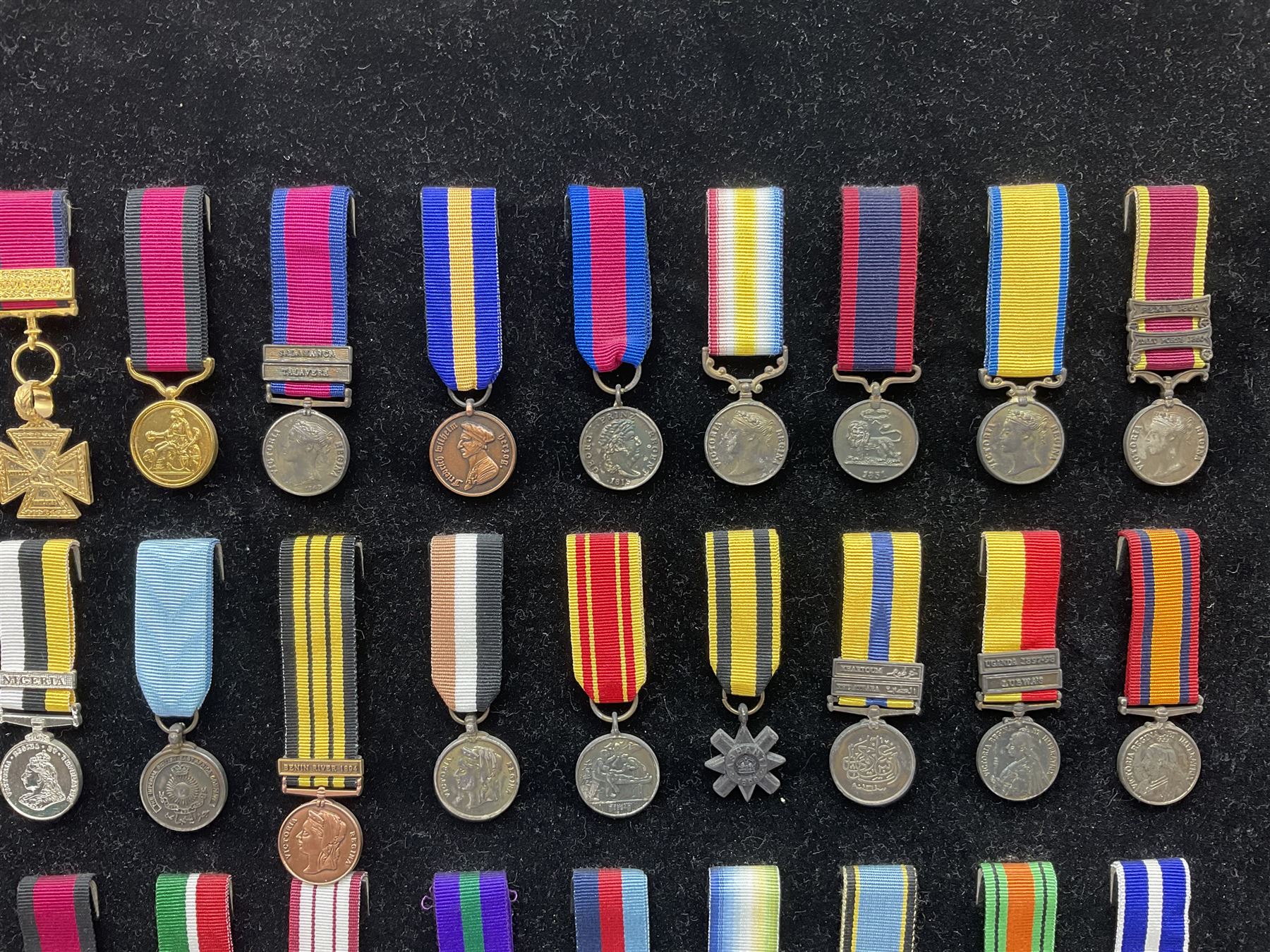 Two limited edition large framed display boards with half-size copies of British Gallantry and Campaign Medals produced by Danbury Mint and entitled 'For Valour'. Sixty medals on each board, all with ribbons. Complete with Danbury Mint certificate serial number A0148 and other paperwork.
