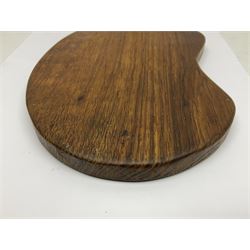 Mouseman - oak kidney-shaped cheeseboard, the handle caved with mouse signature, by the workshop of Robert Thompson, Kilburn 