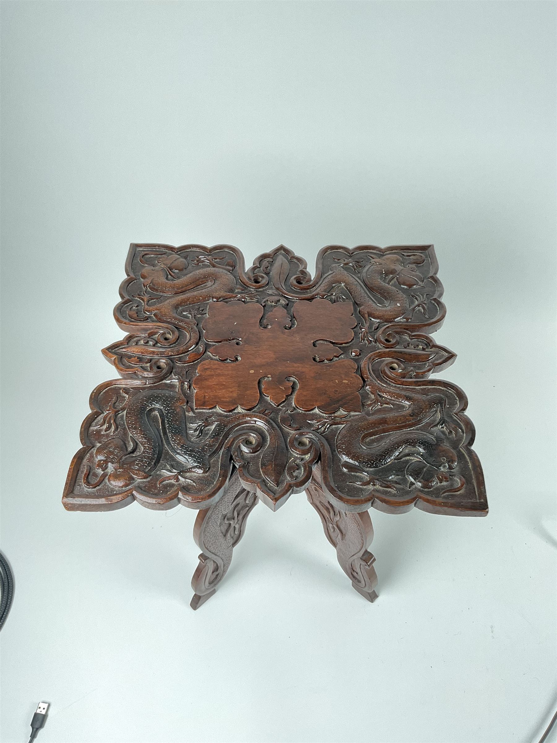 Eastern hardwood folding occasional table, carved with dragons