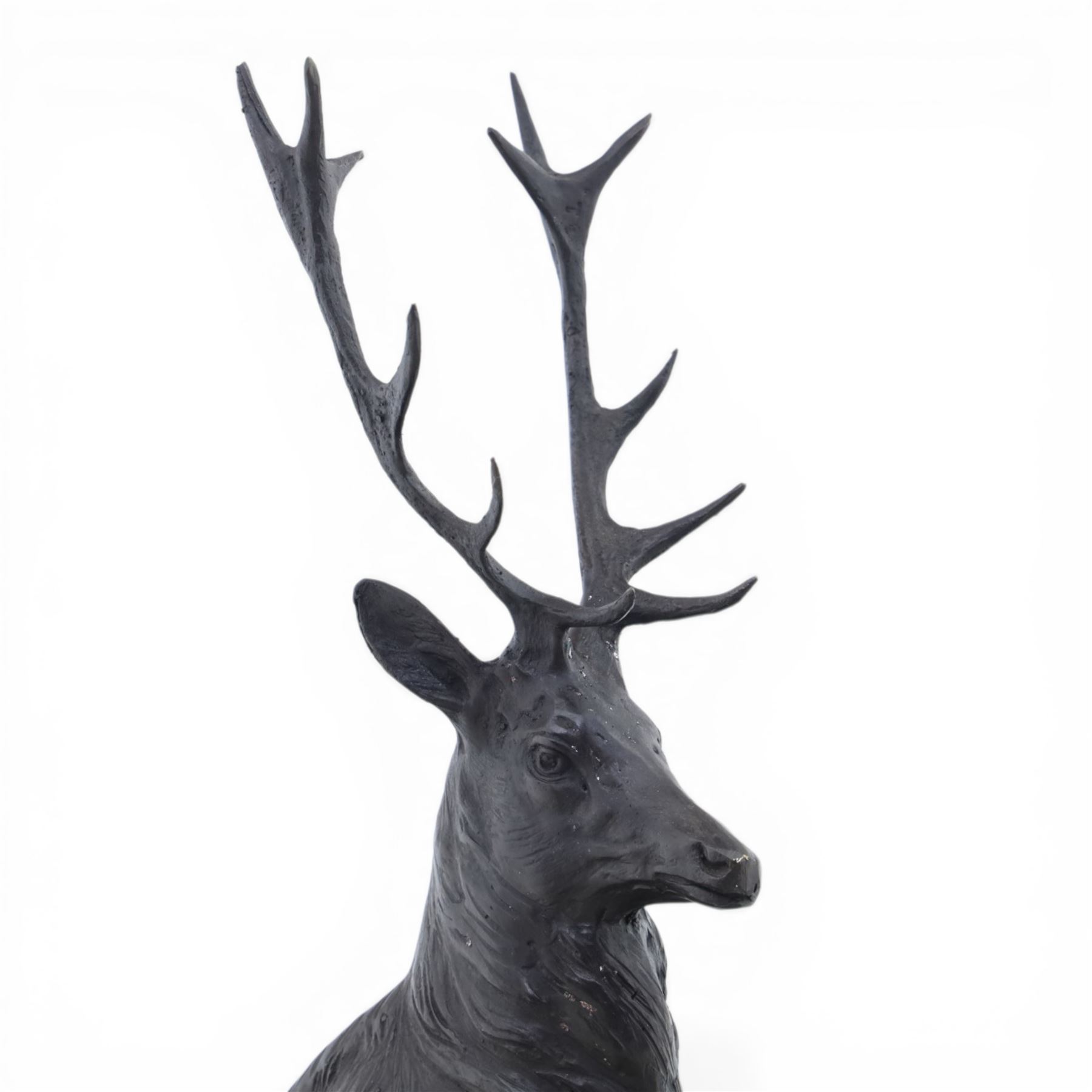 Pair of bronze stags, after Jules Moigniez, modelled in alert stance upon naturalistic bases, set on oval marble plinths, signed to base