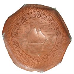 Newlyn Arts and Crafts copper square section vase with flowers and strapwork decoration H21cm and a Newlyn beaten copper circular tray with raised rim and centre panel of a yacht D28cm, both stamped 'Newlyn' (2)