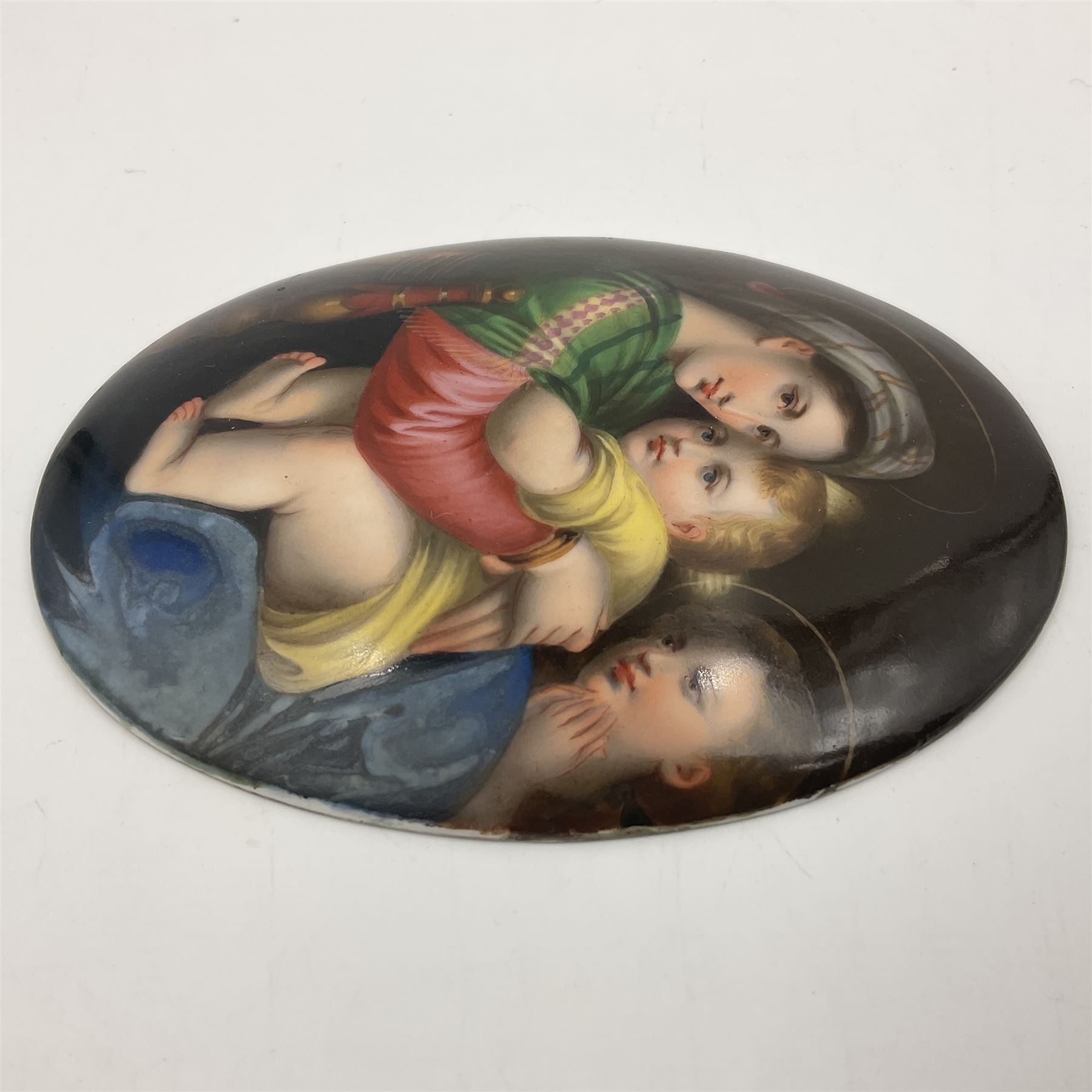 19th century Continental porcelain plaque, of oval form, painted with the Madonna and Child after Raphael, unmarked, possibly KPM, H12cm W9cm 