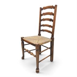 19th century set of six ash and elm ladderback dining chairs, shaped ladder backs above rush seats, raised on turned front supports with pad feet, united by turned stretchers