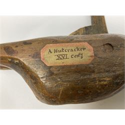 Rare primitive treen lever action nutcracker, probably late 17th/early 18th century, carved in the form of a man, with old collector label to side inscribed 'A Nutcracker XVI Century', H18cm