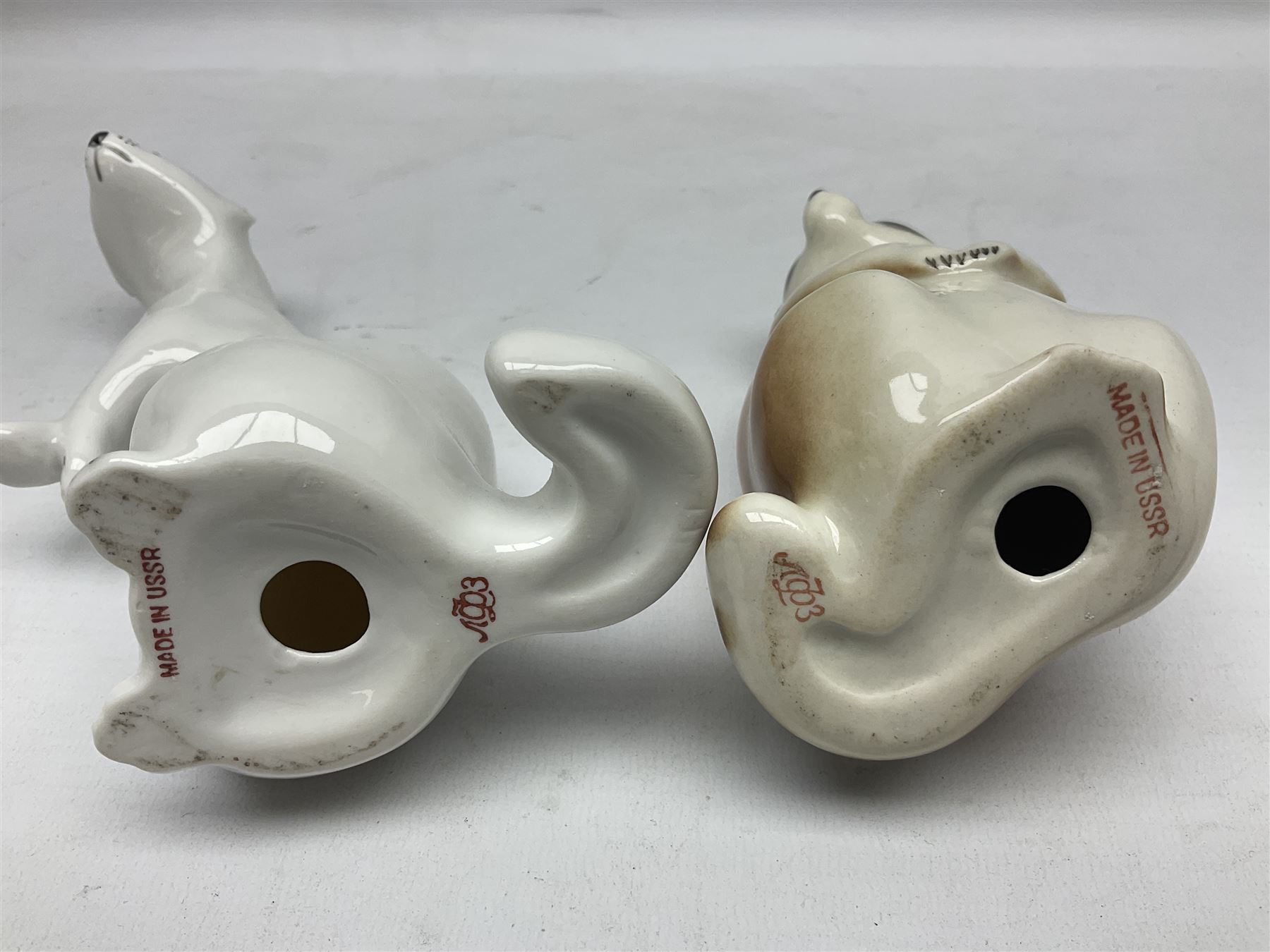 1970's Hornsea mugs, comprising Train Robber pattern designed by John Clappison and Owl from the ‘Newsprint’ Zoo range designed by Jack Dadd, and three USSR figures of animals comprising raccoon, ferret and badger