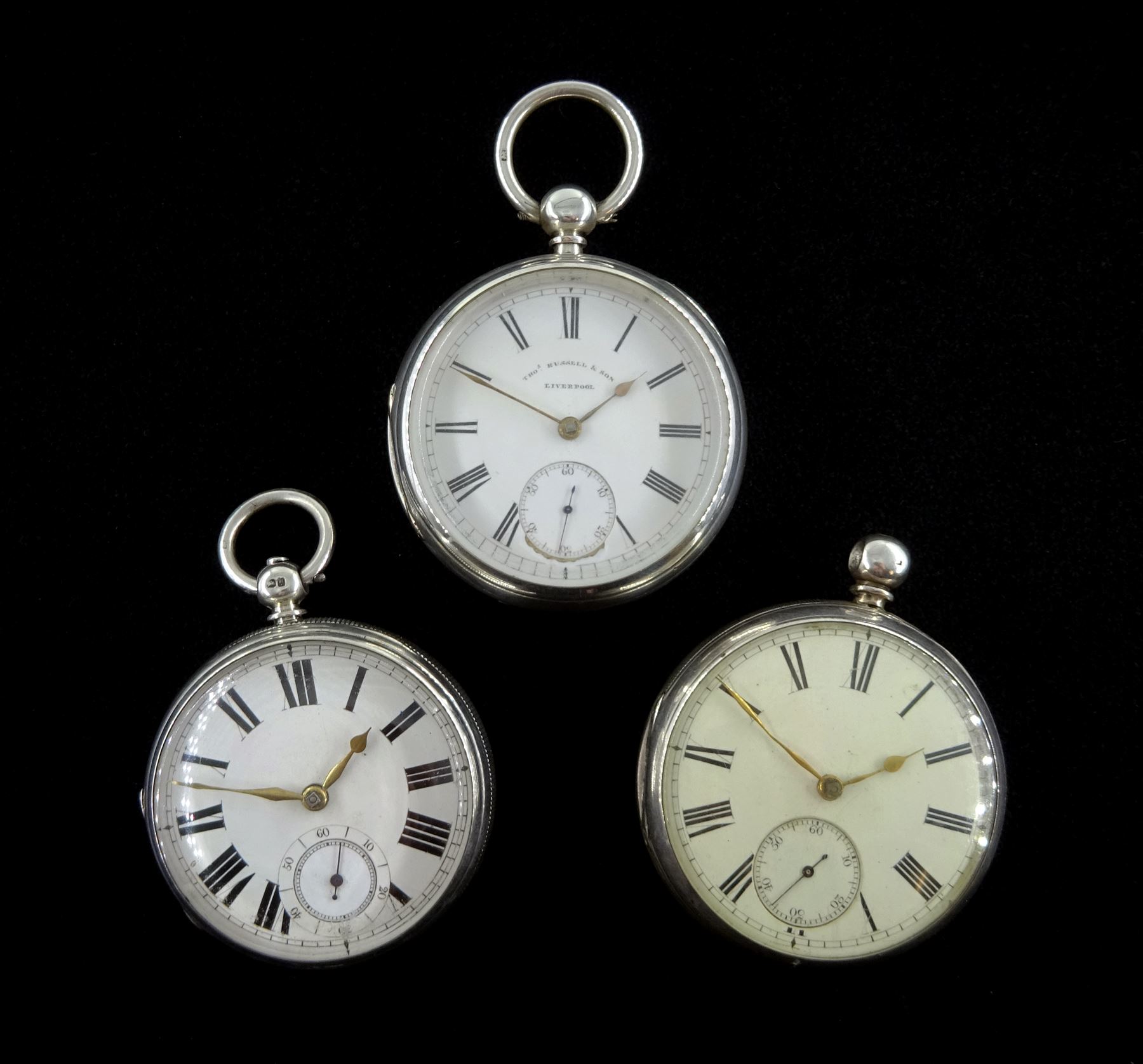 Victorian silver open face English lever fusee pocket watch by Thomas Russel & Son, Liverpool, No. 67496, engraved balance cock with diamond endstone, white enamel dial with Roman numerals and subsidiary seconds dial and two other similar Victorian silver pocket watches, one by M Michael, Edinburgh, all hallmarked (3) 