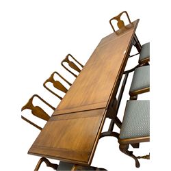 Late 20th century oak dining table, rectangular top with two draw leaf extensions, on turned supports united by moulded hayrake stretchers (180cm - 278cm x 90cm, H76cm); set of eight (6+2) oak dining chairs, shaped cresting rail over shaped splat back, upholster drop-in seat, on cabriole supports united by turned H-shaped stretchers 