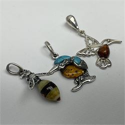 Three silver Baltic amber pendant, including kingfisher, bee and hummingbird 