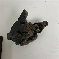 Bronzed cold cast figure of a miner sat beside a lamp by Robert Olley on rocky square plinth base, H17cm