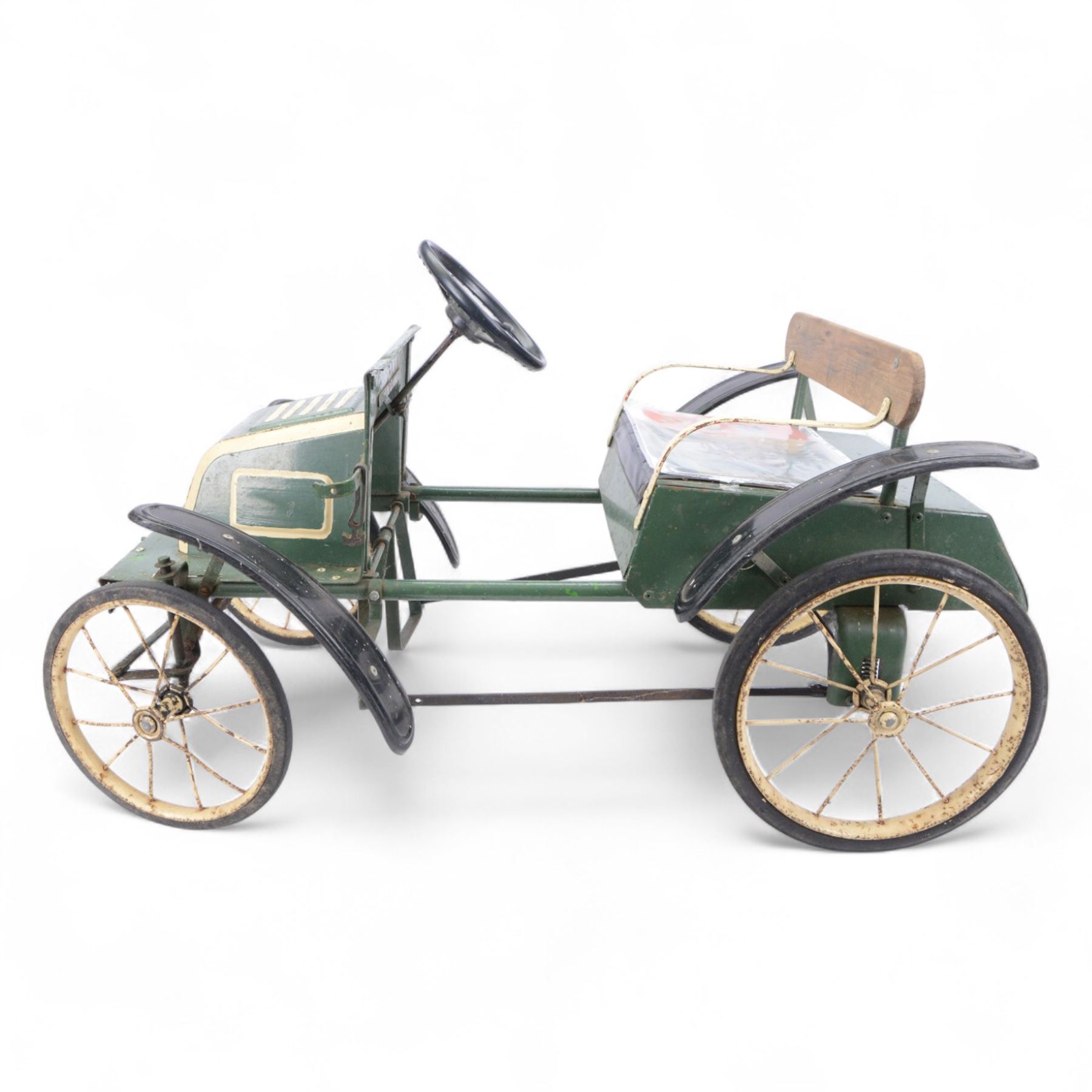 Triang child's pedal car in the style of a vintage automotive, likely a De Dion Bouton or an early Renault, painted in dark green with pale yellow details, H52cm