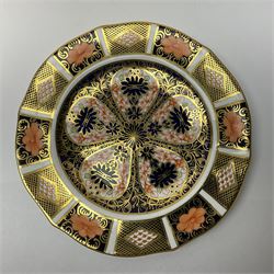 20th century Royal Crown Derby Imari 1128 pattern plates, comprising four side plates and three smaller examples, with printed and painted marks beneath, including illustration date codes for 1918 and 1920, and Roman numeral date code for 1979, larger examples D18cm, smaller D15cm, (7)
