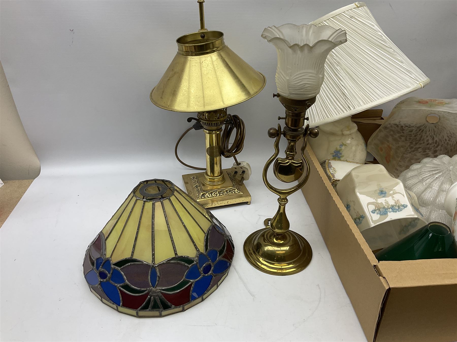 Brassed lamp modelled as a male with basket and fruit after Rancoulet, Tiffany style table lamp, brass table lamp, glass shades etc