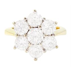 18ct gold diamond flower head cluster ring, seven round brilliant cut diamonds in white go...